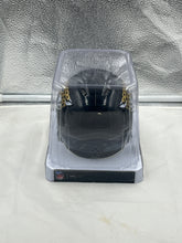 Load image into Gallery viewer, Close-up view of the Jacksonville Jaguars NFL Riddell Speed Black Replica Mini Helmet displaying high-quality craftsmanship and durable materials.