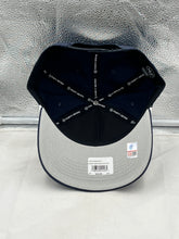 Load image into Gallery viewer, Person wearing the Auburn Tigers NCAA '47 Brand Navy Rope Hitch Snapback Adjustable Hat while cheering at a football game, demonstrating team spirit.