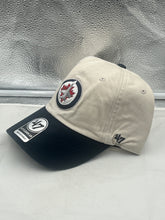Load image into Gallery viewer, Close-up view of the Winnipeg Jets NHL '47 Brand Natural Two Tone Clean Up Adjustable Strapback Hat, highlighting the adjustable strap and quality materials.