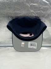 Load image into Gallery viewer, Model wearing Houston Texans NFL '47 Brand Navy Script Hitch Snapback Adjustable Hat in a game day setting, highlighting team pride.