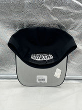 Load image into Gallery viewer, Los Angeles Kings NHL '47 Brand Black Hitch Adjustable Snapback Hat worn by a fan at a hockey game, demonstrating team spirit.