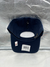 Load image into Gallery viewer, UConn Huskies NCAA '47 Brand 1999 Champs Navy Clean Up Adjustable Strapback Hat worn by a fan at a game, demonstrating style and team pride.