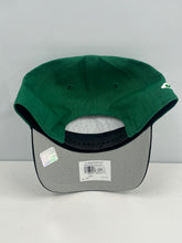 Load image into Gallery viewer, New York Jets NFL '47 Throwback Green Two Tone Hitch Snapback Adjustable Hat displayed outdoors, perfect for showing team spirit during outdoor games.