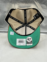 Load image into Gallery viewer, Orlando Magic NBA '47 Brand Natural Two Tone Hitch Snapback Adjustable Hat displayed on a flat surface, emphasizing its vibrant two-tone color scheme.