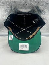 Load image into Gallery viewer, Lifestyle image featuring a fan wearing the Anaheim Ducks NHL '47 Brand Throwback Black Hitch Adjustable Snapback Hat in a casual setting.