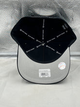 Load image into Gallery viewer, Versatile New York Mets MLB '47 Brand Black Hitch Adjustable Snapback Hat worn in a casual setting, ideal for representing team spirit while enjoying outdoor activities.