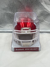 Load image into Gallery viewer, Display setup featuring the Wisconsin Badgers NCAA Riddell Speed Red Flash Alternate Mini Helmet ideal for fan caves and memorabilia collections.
