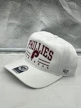 Load image into Gallery viewer, Close-up view of the Philadelphia Phillies MLB '47 Brand White Roscoe Hitch Adjustable Snapback Hat highlighting its durable material and vibrant colors, perfect for baseball fans and casual outings.