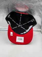 Load image into Gallery viewer, Cincinnati Bearcats hat displayed in outdoor setting, perfect for showing team spirit while enjoying a sunny day.