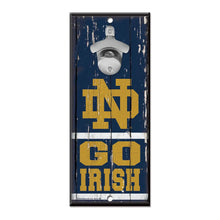 Load image into Gallery viewer, Notre Dame Fighting Irish NCAA Wall Mounted Bottle Opener showcasing the iconic team logo, perfect for fans, measuring 11" x 5", a functional and stylish addition to any game day gathering.