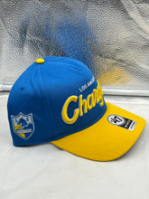 Load image into Gallery viewer, Close-up view of the Los Angeles Chargers NFL '47 Blue Two Tone Script Hitch Snapback Adjustable Hat logo emphasizing the modern script design.