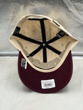 Load image into Gallery viewer, Close-up view of the Vancouver Canucks NHL '47 Brand Throwback Clean Up Tan Two Tone Adjustable Hat, emphasizing the quality materials and adjustable strap for a perfect fit.