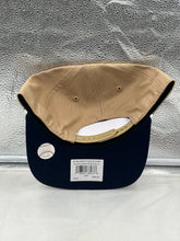 Load image into Gallery viewer, Side angle of the Yankees Vs Padres 1998 World Series Dueling MLB '47 Khaki Hitch Adjustable Hat worn by a fan at a baseball game.