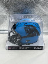 Load image into Gallery viewer, Close-up view of the Carolina Panthers NFL Riddell Speed Blue Rave Alternate Replica Mini Helmet highlighting its vibrant colors and detailed design.