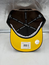 Load image into Gallery viewer, Lifestyle image of a person wearing the San Diego Padres MLB '47 Brand Brown Hitch Adjustable Snapback Hat outdoors, demonstrating how this stylish San Diego Padres hat complements casual outfits.