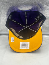 Load image into Gallery viewer, Lifestyle shot of a person wearing the LSU Tigers NCAA '47 Brand Purple Rope Script Hitch Adjustable Hat while enjoying a game day, showcasing school spirit.