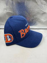 Load image into Gallery viewer, Denver Broncos NFL '47 Throwback Corduroy Blue Hitch Snapback Adjustable Hat worn by a fan at a game, displaying team spirit.