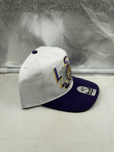 Load image into Gallery viewer, LSU Tigers hat on a table, highlighting its lightweight fabric suitable for warm weather.
