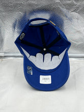 Load image into Gallery viewer, Person wearing the St Louis Blues NHL '47 Brand Throwback Blue Clean Up Adjustable Strapback Hat while cheering at a game, demonstrating its comfortable fit.