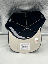 Load image into Gallery viewer, Tennessee Volunteers NCAA '47 Throwback Black Hitch Snapback Adjustable Hat featured against a stadium background, perfect for game day or casual wear.