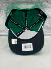 Load image into Gallery viewer, Styled photo of a fan wearing the Philadelphia Eagles NFL '47 Throwback Green Script Hitch Snapback Adjustable Hat at a game, showcasing team spirit.