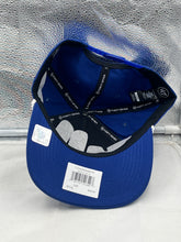 Load image into Gallery viewer, Person wearing the Buffalo Bills NFL '47 Blue Overhand Script Rope Hitch Snapback Adjustable Hat at a game, demonstrating style and team spirit.