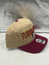 Load image into Gallery viewer, Model wearing the Florida State Seminoles FSU NCAA '47 Brand Khaki Two Tone Hitch Adjustable Hat outdoors at a game event.