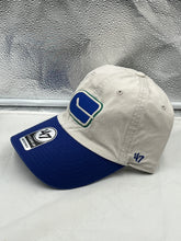 Load image into Gallery viewer, Side view of the Vancouver Canucks NHL '47 Brand Throwback Clean Up Tan Two Tone Adjustable Hat, highlighting its adjustable strap for a perfect fit.