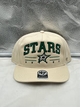 Load image into Gallery viewer, Dallas Stars NHL '47 Brand Natural Script Roscoe Hitch Adjustable Snapback Hat displayed on a white background highlighting its stylish design.