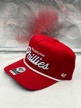Load image into Gallery viewer, Philadelphia Phillies MLB '47 Brand Red Script Hitch Adjustable Snapback Hat worn by a fan outdoors, illustrating the adjustable fit and stylish design, perfect for game day or casual outings.