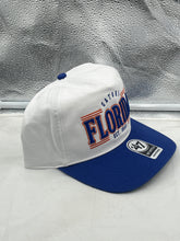 Load image into Gallery viewer, Florida Gators NCAA '47 Brand White Two Tone Script Rope Hitch Adjustable Hat displayed on a table, highlighting its stylish two-tone design.