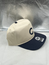 Load image into Gallery viewer, Lifestyle shot of a person wearing Chicago Cubs MLB '47 Brand Natural Two Tone Hitch Adjustable Snapback Hat at a baseball game.