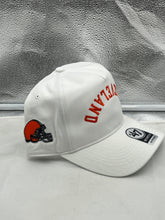 Load image into Gallery viewer, Cleveland Browns NFL '47 White Reversed Script Hitch Snapback Adjustable Hat worn by a fan at a game, highlighting comfort and team spirit.