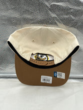 Load image into Gallery viewer, Person wearing the Oregon Ducks NCAA '47 Brand Natural Two Tone Hitch Adjustable Snapback Hat at an outdoor event, demonstrating its versatility and comfort.