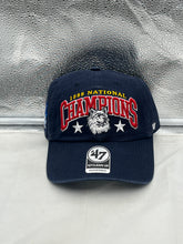 Load image into Gallery viewer, UConn Huskies NCAA '47 Brand 1999 Champs Navy Clean Up Adjustable Strapback Hat displayed at an angle, showcasing its vintage design and adjustable strap.