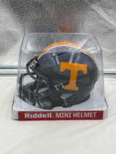 Load image into Gallery viewer, Close-up of the Tennessee Volunteers NCAA Riddell Smoky Mountain Alternate Replica Mini Helmet highlighting its quality craftsmanship and durable design.