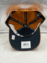 Load image into Gallery viewer, Model wearing the Texas Longhorns NCAA '47 Brand Throwback Orange Hitch Snapback Adjustable Hat at a sporting event, exhibiting style and team pride.