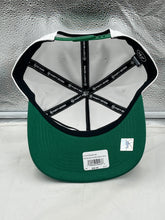 Load image into Gallery viewer, Lifestyle image of a person wearing the Boston Celtics NBA '47 Brand White Two Tone Hitch Adjustable Snapback Hat at a basketball game.