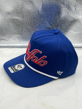 Load image into Gallery viewer, Buffalo Bills NFL '47 Blue Overhand Script Rope Hitch Snapback Adjustable Hat displayed on a table, showcasing its vibrant blue design and unique rope hitch detail.
