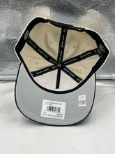 Load image into Gallery viewer, Model wearing the Michigan Wolverines NCAA '47 Brand Natural TT Hitch Adjustable Snapback Hat at a game, representing team pride and spirit.