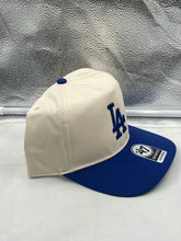 Load image into Gallery viewer, Close-up of the Los Angeles Dodgers logo on the '47 Brand Natural Two Tone Hitch Adjustable Snapback Hat.