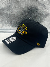 Load image into Gallery viewer, Close-up view of the Boston Bruins NHL '47 Brand Black Clean Up Strapback Adjustable Hat showcasing the logo and quality fabric of this Boston Bruins hat.