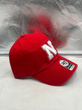 Load image into Gallery viewer, Close-up view of the Nebraska Cornhuskers NCAA '47 Red Clean Up Adjustable Strapback Hat, highlighting the high-quality material and breathable fabric for comfort.