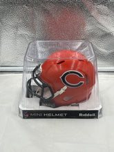 Load image into Gallery viewer, Chicago Bears NFL Riddell Speed Orange Alternate Replica Mini Helmet displayed prominently on a shelf, emphasizing its collectible design.