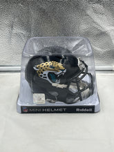 Load image into Gallery viewer, Jacksonville Jaguars NFL Riddell Speed Black Replica Mini Helmet showcasing the sleek matte finish and bold Jaguars logo, ideal for collectors and fans.