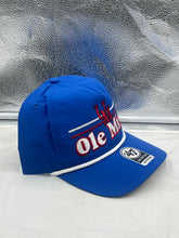 Load image into Gallery viewer, Model wearing Ole Miss Rebels NCAA '47 Brand Blue Script Rope Hitch Adjustable Snapback Hat during a sunny outdoor event, perfect for showing team pride.