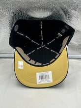 Load image into Gallery viewer, Person wearing the Colorado Buffaloes NCAA '47 Brand Black Script Hitch Adjustable Snapback Hat while cheering at a sports game, showcasing its comfortable fit and team spirit.