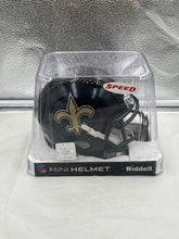 Load image into Gallery viewer, New Orleans Saints NFL Riddell Speed Black Alternate Replica Mini Helmet displayed prominently showing off its sleek design and authentic team branding.