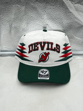 Load image into Gallery viewer, New Jersey Devils NHL '47 Brand White Diamond Hitch Adjustable Snapback Hat showcasing its sleek design and adjustable fit, perfect for fans of the team.