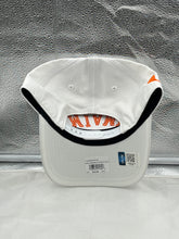 Load image into Gallery viewer, Person wearing the Miami Hurricanes NCAA '47 White Reversed Hitch Script Adjustable Snapback Hat at a game, demonstrating team spirit and style.